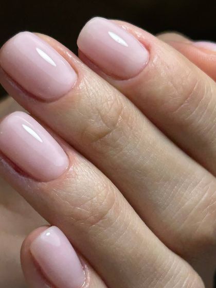 A delicate, sheer pink manicure. This clean and natural look is achieved with a BIAB overlay to provide strength and a flawless finish.