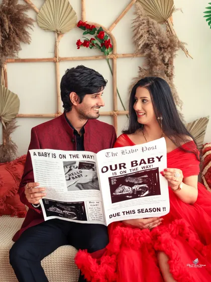 Let's announce it with a headline. We use creative props like this custom "The Baby Post" newspaper to add a fun and personal touch to your couple's maternity session, making your announcement truly unique.