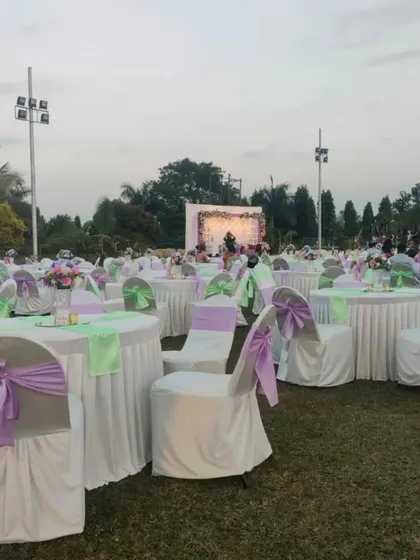 We cater to celebrations of all sizes. This is a glimpse of an elegant outdoor wedding reception we catered at the ASC Centre, with beautiful decor and seating for a large number of guests.