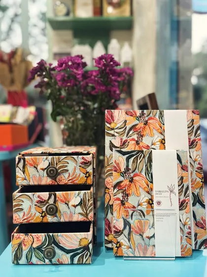 Introducing our 'Darjeeling Sway' collection, a soft burst of florals for your space. We designed this print in-house and handcrafted each piece, from desk organizers to keepsake boxes, using pure cotton. It’s a little piece of joy, made with love.