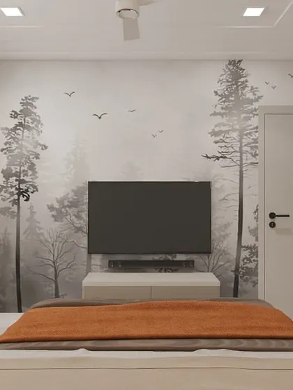 In this view, you can see the feature wall with its subtle, misty forest wallpaper, which adds depth and a sense of tranquility. The wall-mounted TV and floating console maintain the room's clean lines and uncluttered feel.