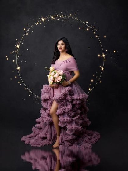 A magical portrait in a dusty lavender ruffled gown. The sparkling ring of light and water reflection create a dreamy, ethereal atmosphere.