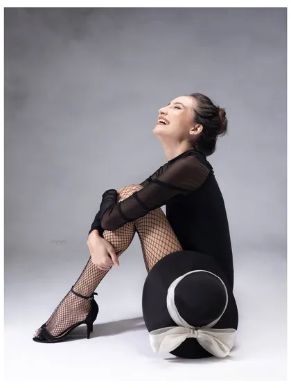 The best portraits capture a feeling. This image is all about the pure, uninhibited joy that comes from feeling completely at ease and celebrated in front of the camera.