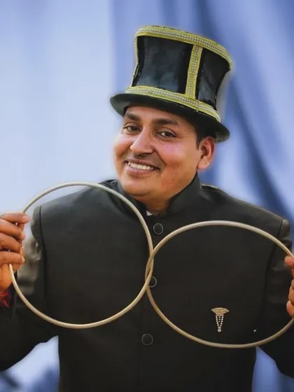 Another pose with the linking rings. This timeless trick demonstrates skill and precision, core elements of my magical craft.