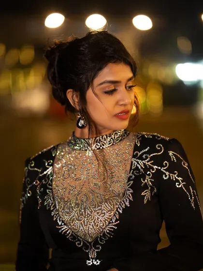 Another portrait of Sanjanaa Anand from the same night shoot, capturing a thoughtful and elegant expression.