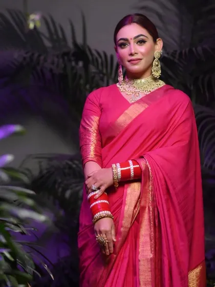 A stunning party look in a bright pink saree. I created a classic look with smokey eyes and traditional red bangles.