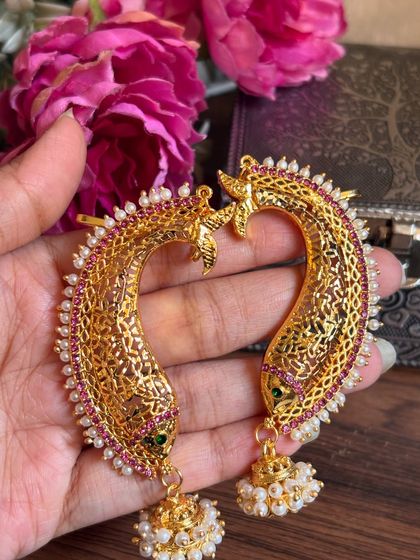 Another angle of the fish-design ear cuffs, showing the delicate jaali work.