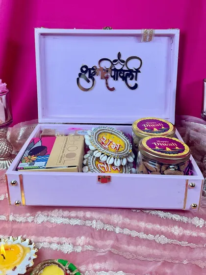 Here’s what’s inside our pink Diwali trunk! We’ve filled it with jars of delicious dry fruits, traditional 'shubh labh' hangings, and other festive treats, all nestled beautifully with a 'Shubh Deepawali' message.