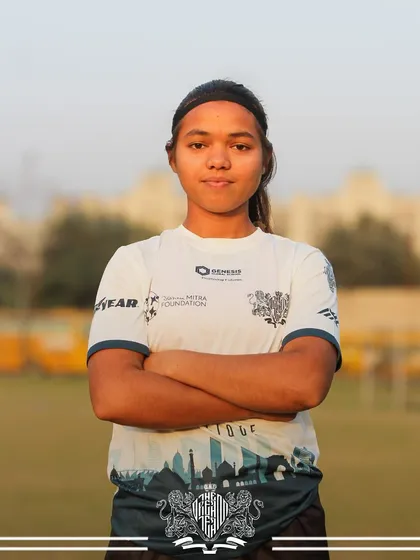 Confidence personified. A player from our women's team stands with arms crossed, ready for the competition.