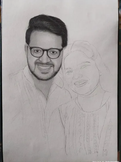 A work in progress shot of the couple's portrait, with the man's face shaded and the woman's still as a line drawing.