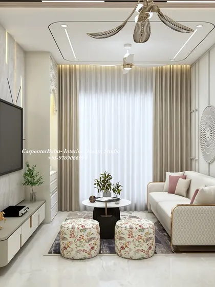This compact living room is designed for maximum style and function. The TV unit is sleek and minimal, while the wall paneling and floral ottomans add texture and personality.