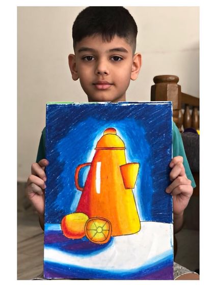 The young artist holding his impressive still life drawing. Every child is an artist, and I am here to help them discover their talent.