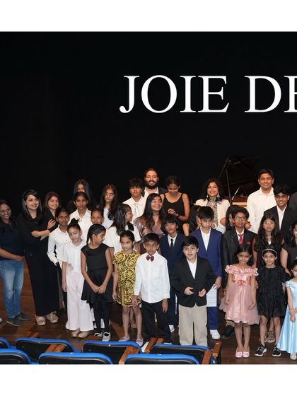 The full cast of 'Joie De Vivre' on the NCPA stage. This group photo captures the sense of community and shared achievement that our annual recitals foster.