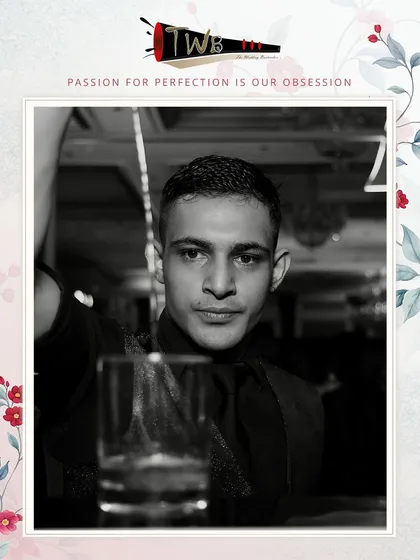 A bartender captured in a classic black and white shot, focusing on the art of the pour.