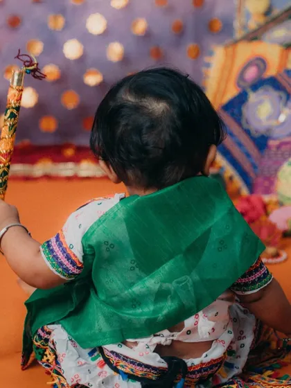 A sweet shot from the back, showing the beautiful details of her traditional ghagra choli.