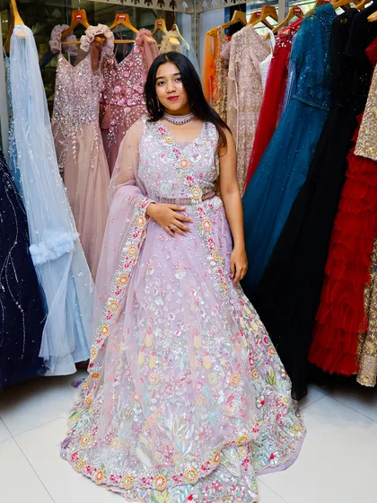 Another angle of the lavender lehenga, surrounded by other colorful options in my store, showcasing the variety I offer.