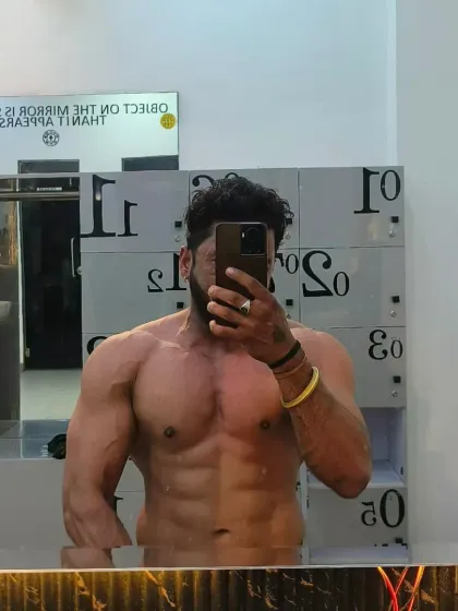 Another locker room selfie showing a defined chest and arms. The work never stops, and the results speak for themselves.