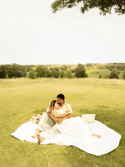 A peaceful outdoor scene with the couple and their fur baby, enjoying a quiet moment before the new arrival.