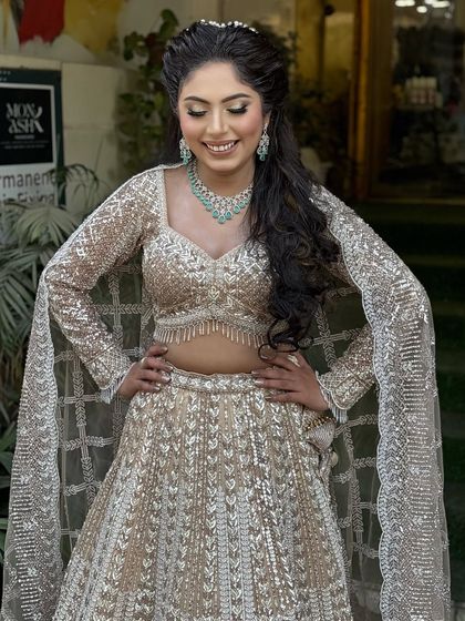 This client was all smiles in her sparkling beige lehenga for her engagement. I gave her a soft glam look with defined eyes and a beautiful, intricate hairstyle.