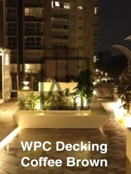 Here is a WPC (Wood Plastic Composite) decking project for a terrace, shown at night. The coffee-brown decking is completely waterproof and handles sun and rain without fading, making it ideal for Bangalore weather. The integrated lighting transforms the area into a stylish, usable space after dark.