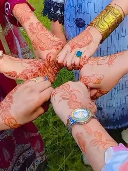A fun group shot showing off everyone's beautiful henna stains. Perfect for parties!