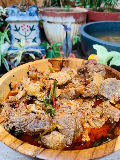 Another shot of my beef curry with bamboo shoot and Naga herbs, served in a traditional wooden bowl.