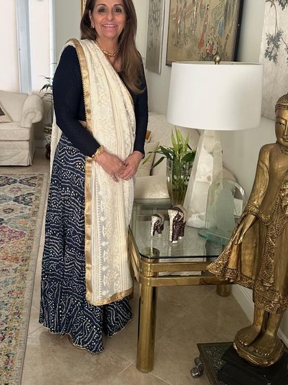 A client looking effortlessly elegant in a Bandhani skirt paired with a simple black top and a beautiful Chikankari dupatta. A perfect example of mixing and matching.