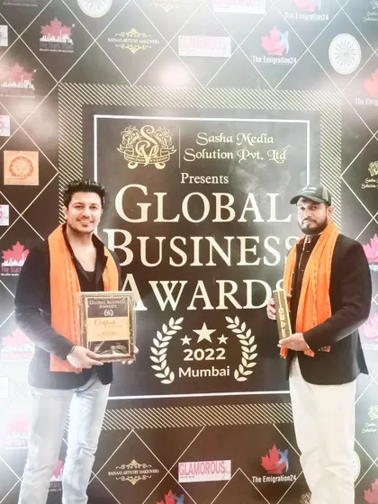 Standing with our 'Best Yoga Center' award at the Global Business Awards 2022 in Mumbai.