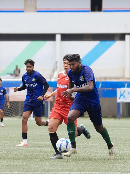 The heat of the battle. This action shot captures the intensity and focus of our players during a competitive match, where every dribble and tackle is a learning opportunity.