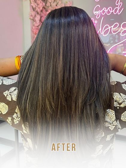 The "after" shot, revealing a stunning transformation with foils and global colour that add dimension, shine, and life to the hair.