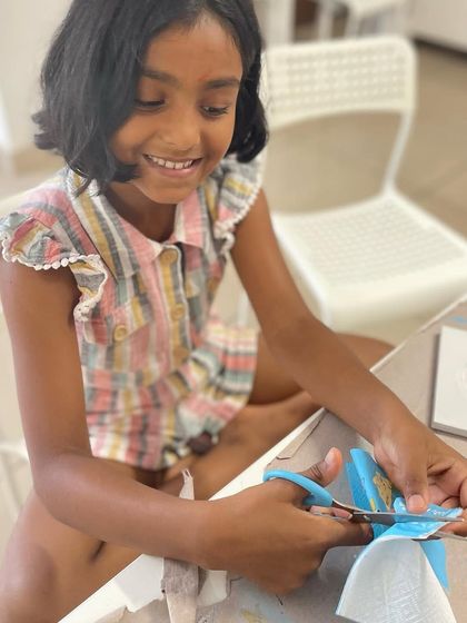 Cutting out the perfect shapes from decorative napkins is a key step in the decoupage process.