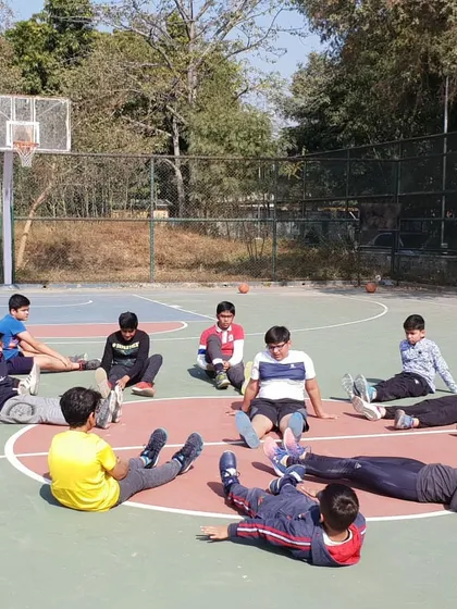 We end our sessions with proper stretching to ensure our athletes' longevity in the sport. Players are seen here performing cool-down stretches to improve flexibility and aid in muscle recovery.