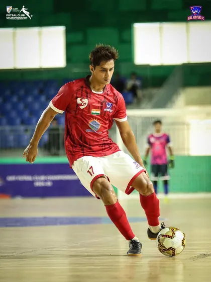 A player in full control of the ball, driving forward.