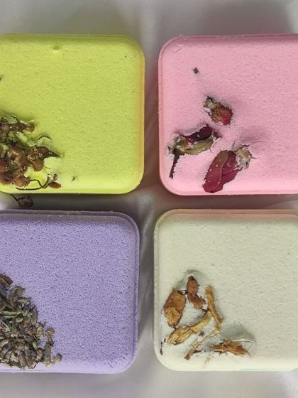 These square bath bombs are infused with real dried herbs like lavender and rose petals. They are designed to rejuvenate your senses and provide a relaxing, aromatic bathing experience.