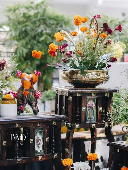 We use small, decorative elements like these hand-painted wooden elephants to add character and detail to our event styling, creating visual interest for guests.