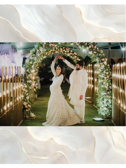 A dreamy dance under a floral archway. This shot of Adarsh and Premika captures the romance and elegance of their reception night.