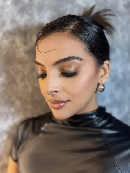 Another angle of the shimmery eye look, showing how the light catches the glitter. This is perfect for a party or editorial shoot.