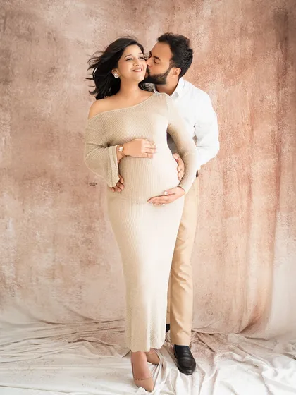 A sweet kiss for the mamma-to-be. This is a beautiful shot from a returning client, and it's so special to capture their growing family.