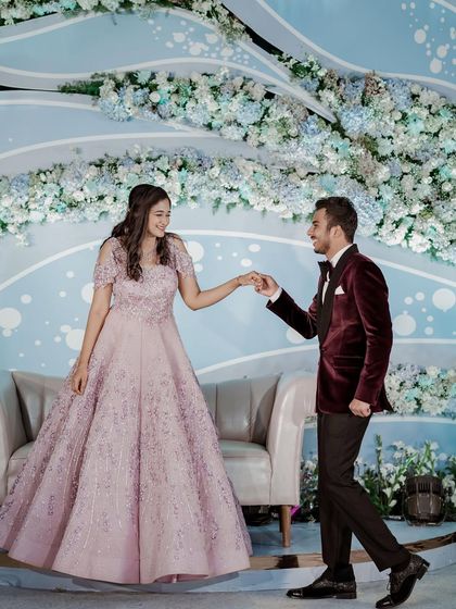 Another shot of the couple on their engagement stage. The groom is leading his bride, and she looks absolutely radiant.