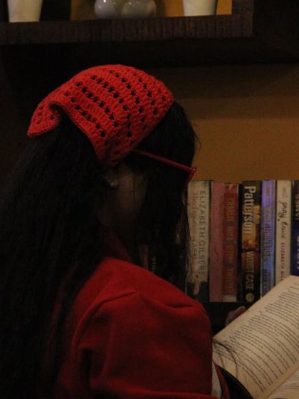 For a bolder look, here is my fiery red crochet bandana. It adds a vibrant pop of color to any outfit, perfect for a book cafe vibe.