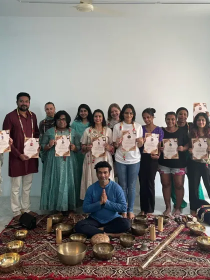 A group of graduates from the Singing Bowl and Sound Healing TTC, celebrating their achievement together.