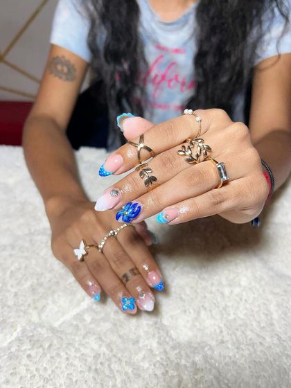 A vibrant blue and white set with glitter, foil, and butterfly accents. This shows how to mix different materials to create a dynamic and fun look.