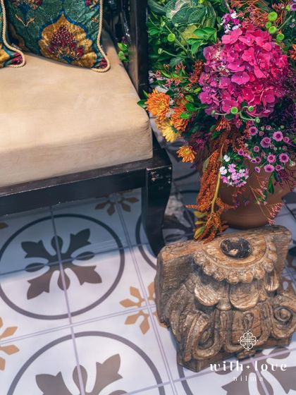 A detail of the tiled flooring and floral decor at a Pellikuthuru ceremony.