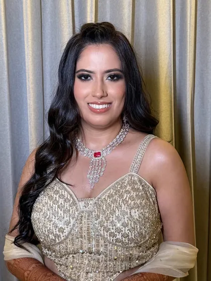 Shimmer, smoke, and that signature glow for an engagement night. I went with a bold smokey glitter eye and a nude glossed lip.