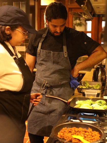 Supervising the cooking process. Whether it's searing vegetables or preparing a complex sauce, I am hands-on at every stage of the meal.