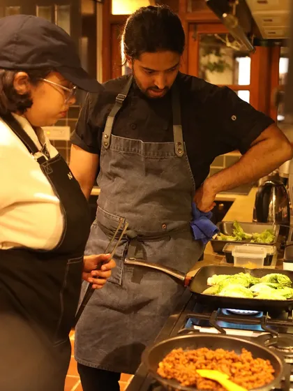 Supervising the cooking process. Whether it's searing vegetables or preparing a complex sauce, I am hands-on at every stage of the meal.