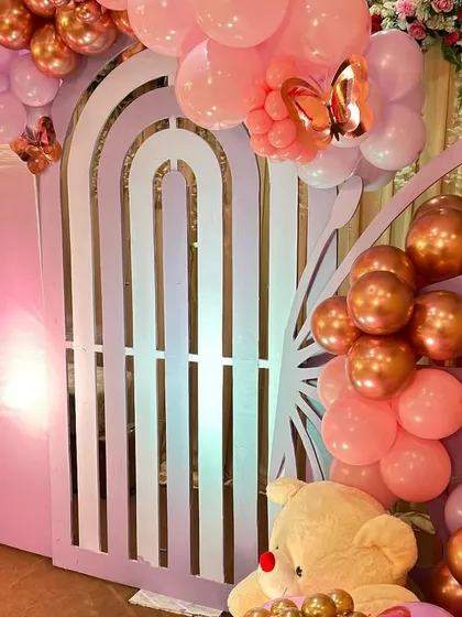 A detailed shot of the butterfly wing made of balloons, a creative and eye-catching element of the baby shower stage.