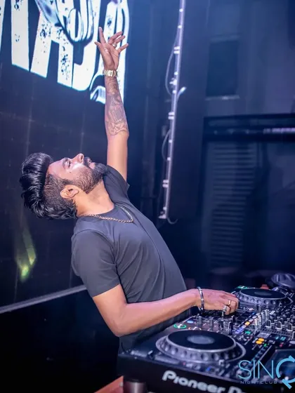 On the console, my job is to bring the josh. This is me in my element, connecting with the crowd and getting everyone to lose themselves in the music. That's the energy I pour into every custom track.