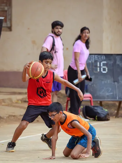 A young player from the U-11 division shows off his dribbling skills, navigating through the defense.