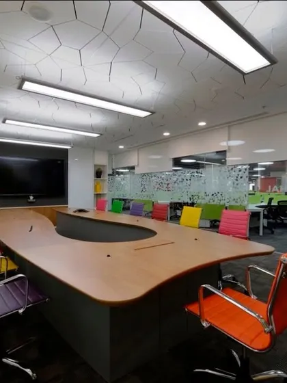 Why can't a boardroom be colorful? We used multi-colored chairs in this conference room to add a sense of fun and creativity to a typically formal space.